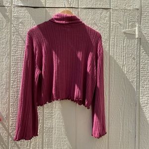 Rose color sweater with flared sleeves